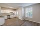 Open kitchen boasts granite counters, stainless appliances, and white cabinets, a seamless blend of style and functionality at 2454 Brianna Dr, Hampton, GA 30228