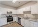 This spacious eat-in kitchen features stainless appliances and granite countertops, a chef's dream at 2454 Brianna Dr, Hampton, GA 30228