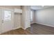 This kitchen flows into a large room and has white cabinets, granite countertops, and stainless appliances at 2454 Brianna Dr, Hampton, GA 30228