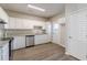 This spacious eat-in kitchen features stainless appliances and granite countertops, a chef's dream at 2454 Brianna Dr, Hampton, GA 30228