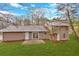 Wide backyard with a stone patio at 3060 Eastland Way, Snellville, GA 30078