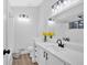 Bathroom features a modern vanity with matte black hardware, white cabinets, and a large mirror at 3060 Eastland Way, Snellville, GA 30078