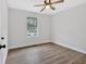 Cozy bedroom with light-colored walls, wood-look floors, and natural light at 3060 Eastland Way, Snellville, GA 30078