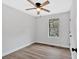 Bedroom featuring wood-look floors, a ceiling fan, and natural light from the window at 3060 Eastland Way, Snellville, GA 30078