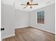 Bedroom featuring wood-look floors, a ceiling fan, and natural light from the window at 3060 Eastland Way, Snellville, GA 30078