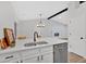 This updated kitchen with stainless steel appliances features an island and breakfast bar seating at 3060 Eastland Way, Snellville, GA 30078
