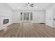 Bright living room features a fireplace, bay windows, and fresh paint at 3060 Eastland Way, Snellville, GA 30078