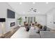 Modern living space featuring a cozy fireplace, neutral palette, and abundant natural light at 3060 Eastland Way, Snellville, GA 30078