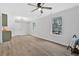 Bright living room with updated floors, ceiling fan, and modern lighting at 3060 Eastland Way, Snellville, GA 30078