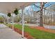 Charming covered front porch with decorative hanging plants, offering a welcoming outdoor space at 3060 Eastland Way, Snellville, GA 30078