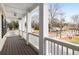 Charming balcony with white railings and a ceiling fan, offering a peaceful outdoor space at 403 Inglenook Walk, Marietta, GA 30060