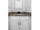 Bathroom vanity with granite countertop and white cabinets at 403 Inglenook Walk, Marietta, GA 30060