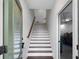 Interior view of the front door, showing a stairway and access to the garage at 403 Inglenook Walk, Marietta, GA 30060