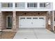 View of the private garage with brick surround and a side entrance door at 403 Inglenook Walk, Marietta, GA 30060