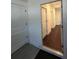 View of the hallway showing the hardwood floors and white paneled doors at 403 Inglenook Walk, Marietta, GA 30060