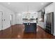 Open concept kitchen featuring stainless steel appliances and a large island at 403 Inglenook Walk, Marietta, GA 30060