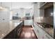 Modern kitchen boasts granite counters, stainless appliances, and ample cabinet space at 403 Inglenook Walk, Marietta, GA 30060