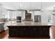 Kitchen with stainless appliances, gray backsplash, granite countertops, and hardwood floors at 403 Inglenook Walk, Marietta, GA 30060