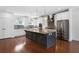 Kitchen with stainless appliances, granite countertops, large island, and hardwood floors at 403 Inglenook Walk, Marietta, GA 30060
