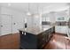 Spacious kitchen featuring stainless steel appliances and a large granite island at 403 Inglenook Walk, Marietta, GA 30060