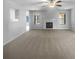 Spacious carpeted living room with fireplace and large windows providing natural light at 5158 Summersun Dr, Morrow, GA 30260