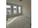 Well-lit bedroom featuring plush carpeting and neighborhood views at 2445 Red Maple Xing Se, Smyrna, GA 30080