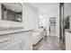 Modern bathroom featuring double vanities, a soaking tub, a glass-enclosed shower, and a walk-in closet at 6838 Prelude Dr, Atlanta, GA 30328