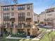 Brick townhome featuring private patios, dark window trim, and a well-manicured lawn at 6838 Prelude Dr, Atlanta, GA 30328