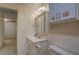 Basement bathroom featuring neutral tile and modern fixtures at 825 Sugar Creek Se Way, Conyers, GA 30094