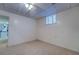 Basement bedroom with neutral carpet and small window at 825 Sugar Creek Se Way, Conyers, GA 30094