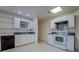 Basement kitchen area featuring white cabinets and laminate countertops at 825 Sugar Creek Se Way, Conyers, GA 30094