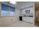 Basement kitchen area with white cabinets and stainless steel oven at 825 Sugar Creek Se Way, Conyers, GA 30094