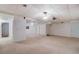 Spacious basement area featuring neutral carpet, white walls, and a drop ceiling at 825 Sugar Creek Se Way, Conyers, GA 30094