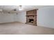 Basement entertainment area featuring a brick fireplace and neutral carpet at 825 Sugar Creek Se Way, Conyers, GA 30094