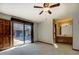 Bedroom featuring an en-suite bathroom and sliding glass doors that lead to a beautiful outdoor pool area at 825 Sugar Creek Se Way, Conyers, GA 30094