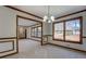 Dining room with wood trim, wainscoting and large windows at 825 Sugar Creek Se Way, Conyers, GA 30094