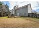 Inviting backyard space with patio, fire pit, and mature trees providing a serene outdoor living area at 1390 Bridle Path Dr, Lawrenceville, GA 30045