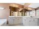 Bright bathroom with double vanity, large mirrors, and ample storage space at 1390 Bridle Path Dr, Lawrenceville, GA 30045