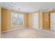 Neutral bedroom with carpet, window, and overhead lighting at 1390 Bridle Path Dr, Lawrenceville, GA 30045
