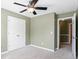 Bedroom featuring a ceiling fan and closet at 1390 Bridle Path Dr, Lawrenceville, GA 30045