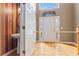 Hardwood floored entry foyer with a sink off to the side, a decorative plant and a staircase nearby at 1390 Bridle Path Dr, Lawrenceville, GA 30045