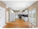 Open concept kitchen features stainless appliances, granite counters, and eat-in area at 1390 Bridle Path Dr, Lawrenceville, GA 30045