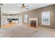 Spacious living room with fireplace and open to the kitchen at 1390 Bridle Path Dr, Lawrenceville, GA 30045