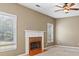 Cozy living room with fireplace and large windows at 1390 Bridle Path Dr, Lawrenceville, GA 30045