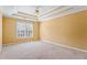Spacious main bedroom with tray ceiling and ceiling fan at 1390 Bridle Path Dr, Lawrenceville, GA 30045