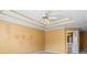 Main bedroom with tray ceiling and ensuite bathroom at 1390 Bridle Path Dr, Lawrenceville, GA 30045