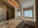 Bathroom with a double sink vanity and soaking tub at 2728 Sandalwood Cir, Locust Grove, GA 30248