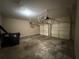 This is an empty garage with a concrete floor and overhead garage door openers at 2728 Sandalwood Cir, Locust Grove, GA 30248