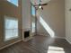Bright living room with a fireplace and tall windows at 2728 Sandalwood Cir, Locust Grove, GA 30248