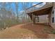 Exterior view of deck with access to the backyard and a wooded backdrop at 5720 Stow Dr, Tucker, GA 30084